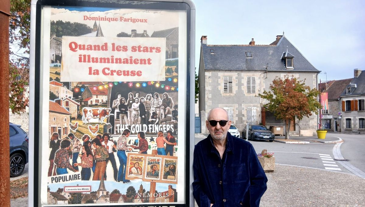 Dominique Farigoux à côté d’un grand panneau affichant la couverture de Quand les stars illuminaient la Creuse